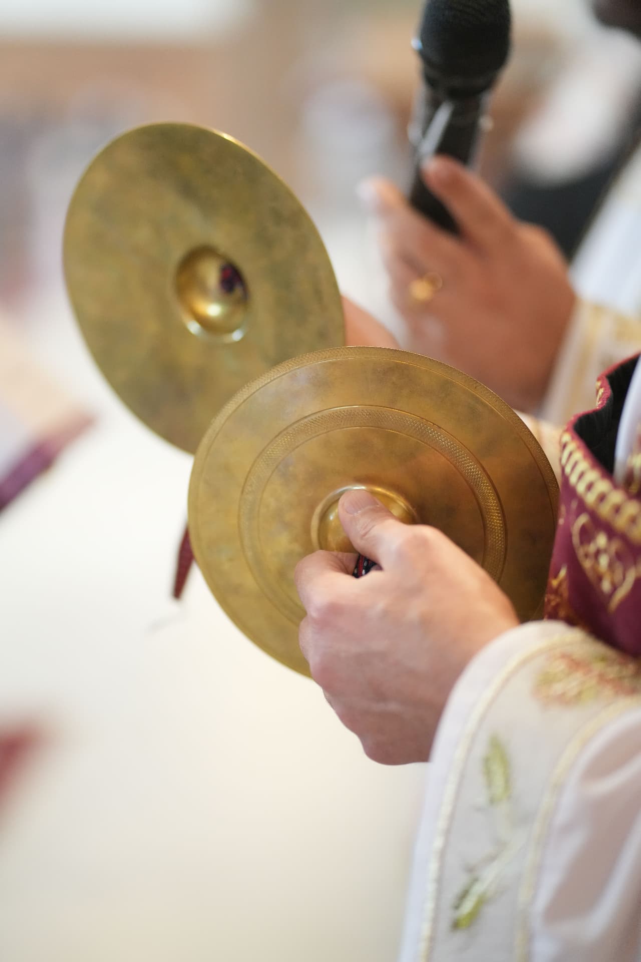 Traditional cymbals held during the wedding ceremony